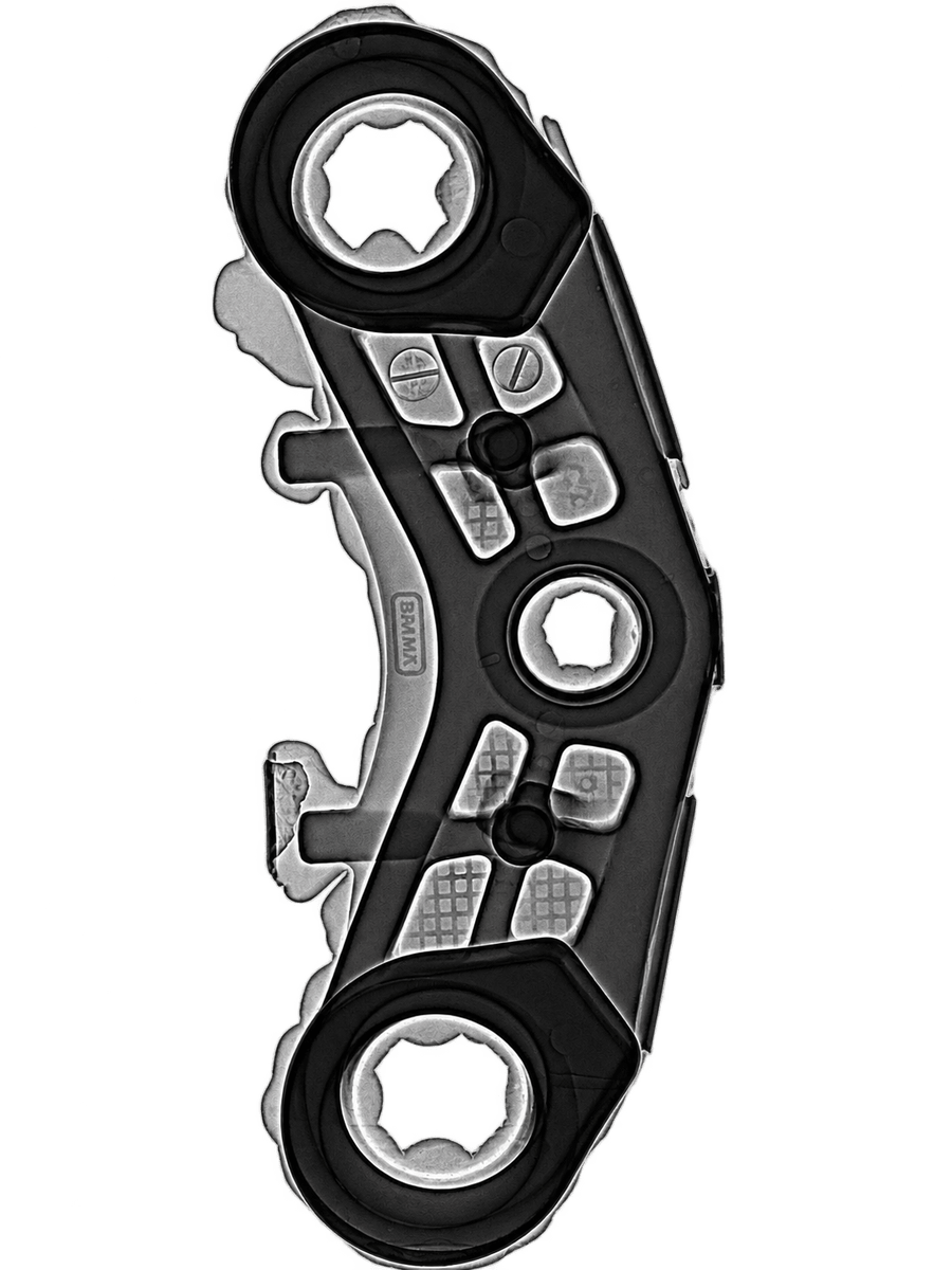 Radiograph of a machined linkage, the kind of image MQS ADR software inspects