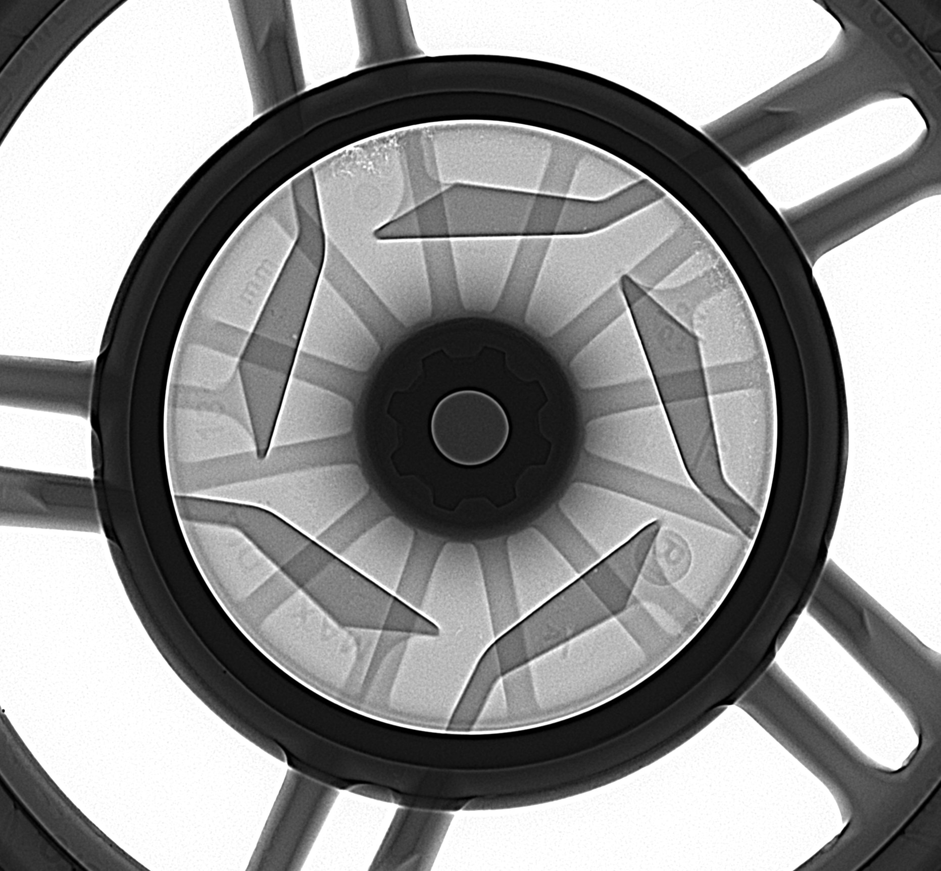 Radiograph of an alloy wheel hub showing internal casting structure